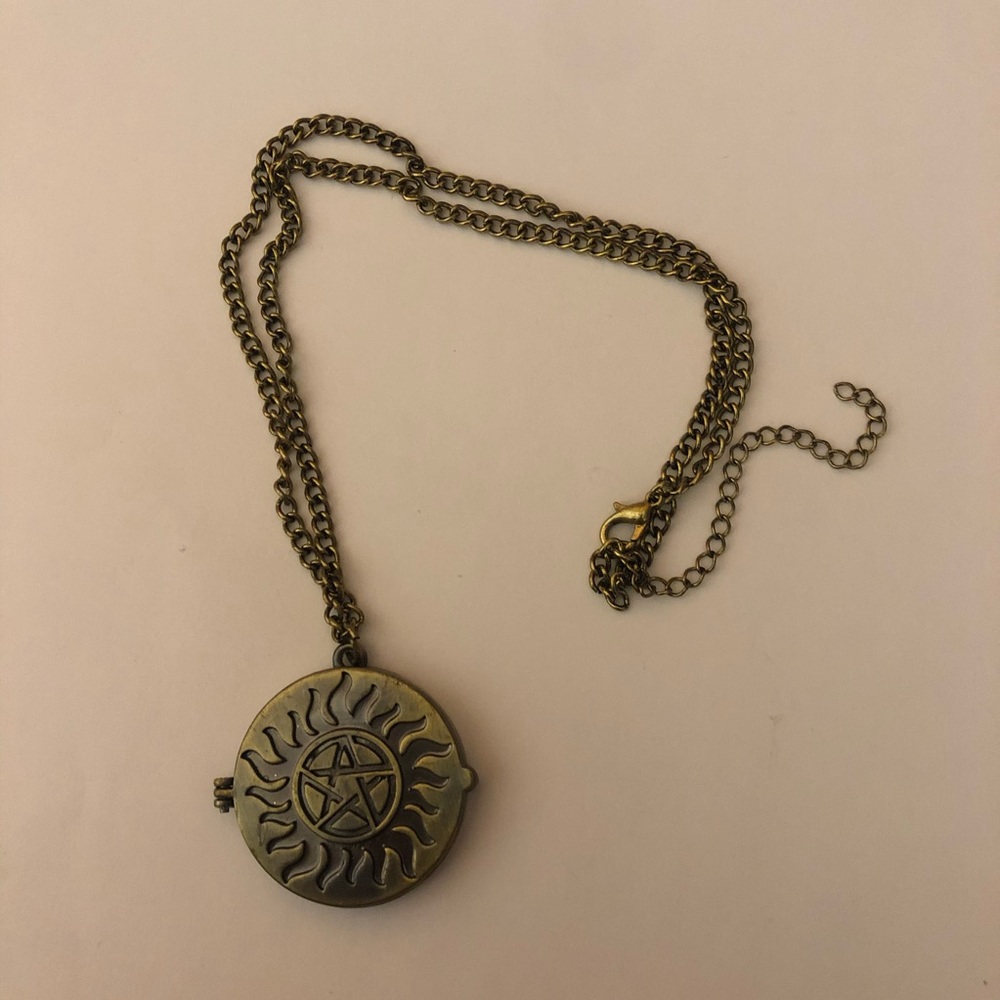 Supernatural open-up pendent necklace.